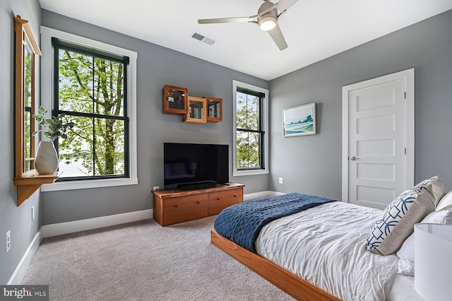 3015 Friends Rd, Annapolis, MD 21401 - carpeted bedroom with multiple windows, baseboards, and ceiling fan