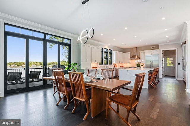 3015 Friends Rd, Annapolis, MD 21401 - dining space with crown molding, plenty of natural light, dark wood-type flooring, recessed lighting, and baseboards