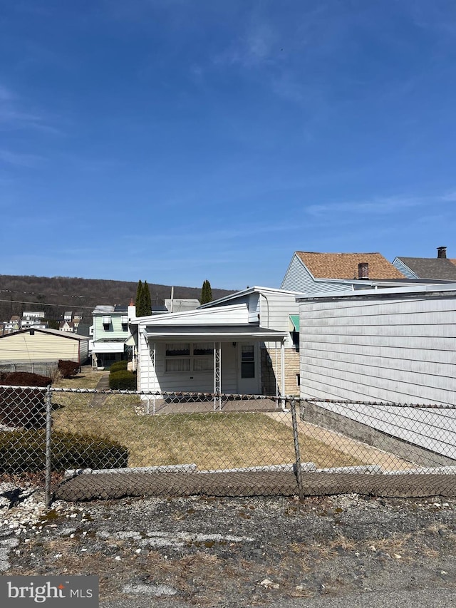 1228 Spruce St, Ashland, PA 17921 - exterior space with a fenced front yard and a lawn