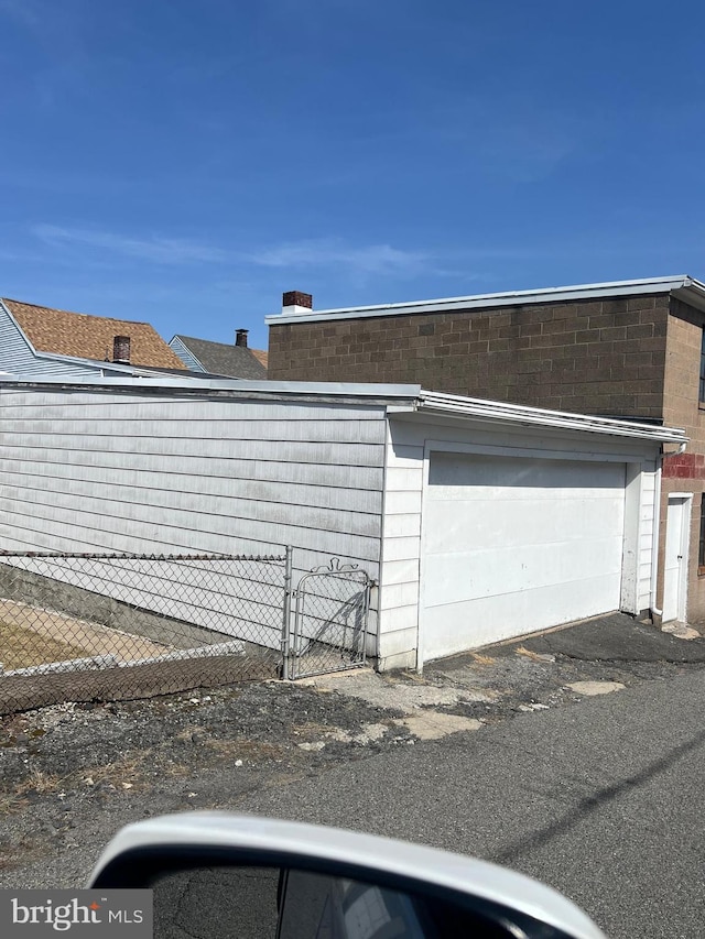 1228 Spruce St, Ashland, PA 17921 - view of side of property featuring fence and an attached garage
