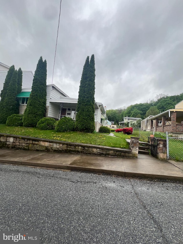 1228 Spruce St, Ashland, PA 17921 - view of property exterior with fence and a lawn