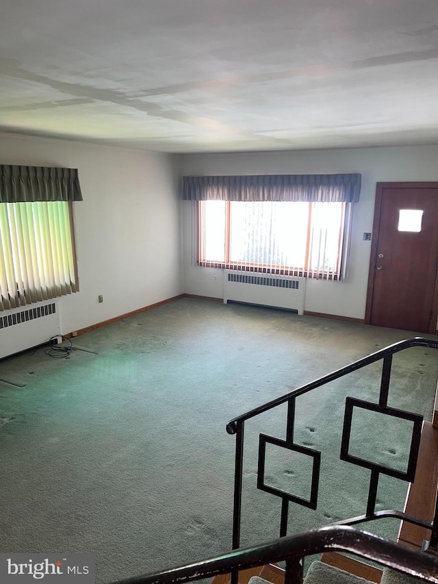 1228 Spruce St, Ashland, PA 17921 - carpeted empty room featuring baseboards and radiator