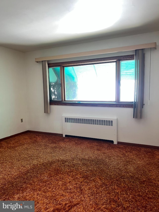 1228 Spruce St, Ashland, PA 17921 - carpeted spare room featuring radiator and baseboards