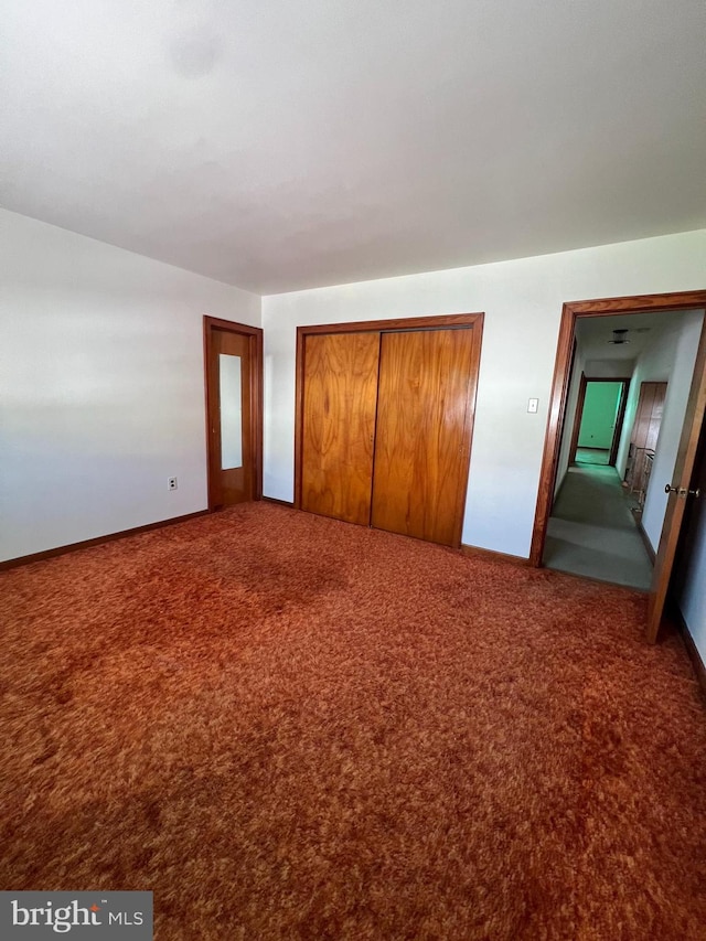 1228 Spruce St, Ashland, PA 17921 - unfurnished bedroom with carpet flooring, a closet, and baseboards