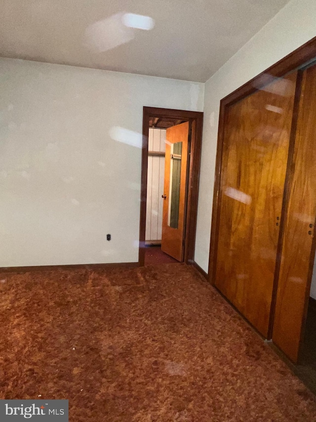 1228 Spruce St, Ashland, PA 17921 - unfurnished bedroom featuring a closet and carpet floors
