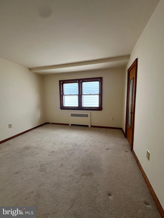 1228 Spruce St, Ashland, PA 17921 - empty room with light colored carpet, radiator, and baseboards