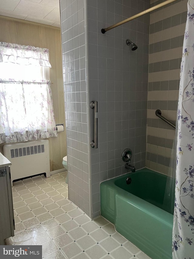 1228 Spruce St, Ashland, PA 17921 - full bathroom with toilet, wooden walls, radiator heating unit, and shower / tub combo