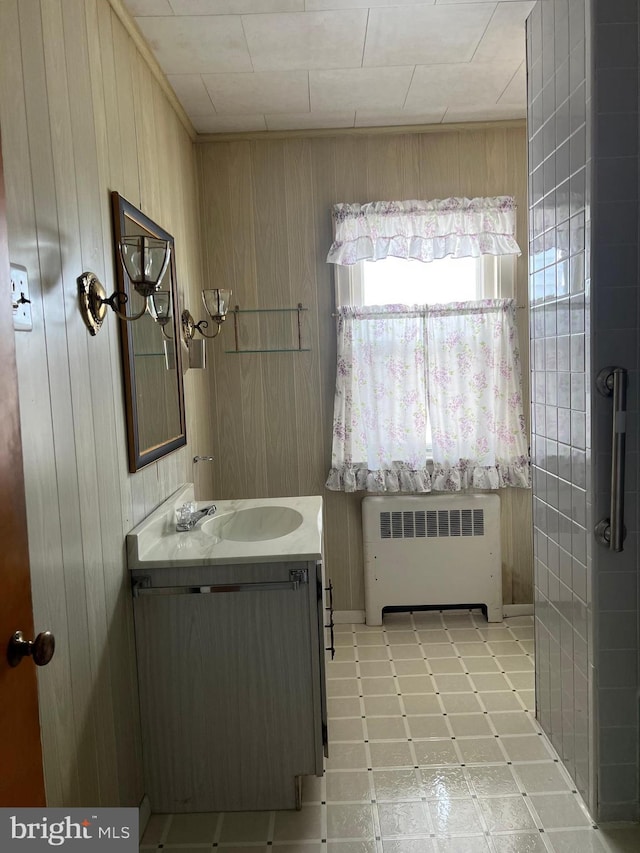 1228 Spruce St, Ashland, PA 17921 - bathroom featuring vanity, wooden walls, radiator, and tile patterned floors