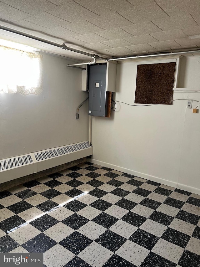 1228 Spruce St, Ashland, PA 17921 - finished basement with baseboards, a baseboard radiator, and electric panel