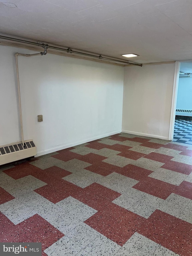 1228 Spruce St, Ashland, PA 17921 - finished basement with baseboards and a baseboard heating unit