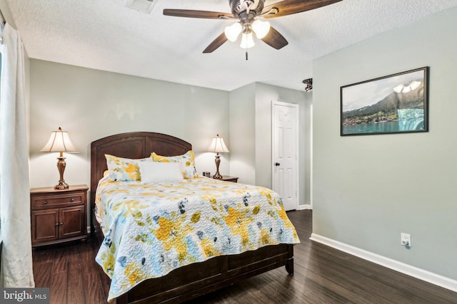 3901 Golf Tee Ct Unit 301, Fairfax, VA 22033 - bedroom featuring baseboards, dark wood-style flooring, a textured ceiling, and a ceiling fan