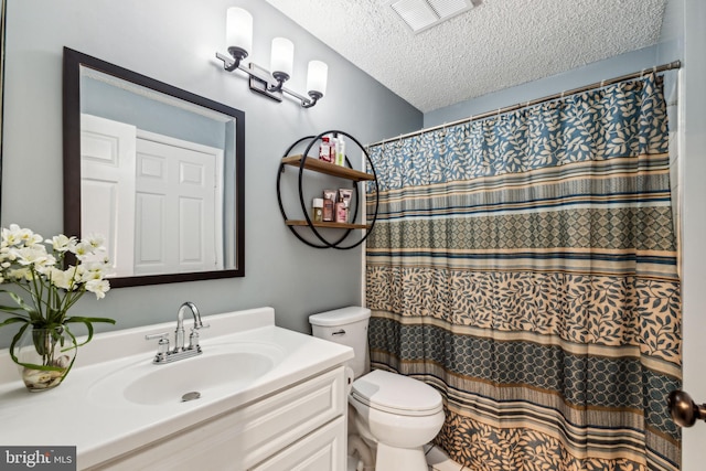 3901 Golf Tee Ct Unit 301, Fairfax, VA 22033 - bathroom with toilet, vanity, a textured ceiling, and curtained shower