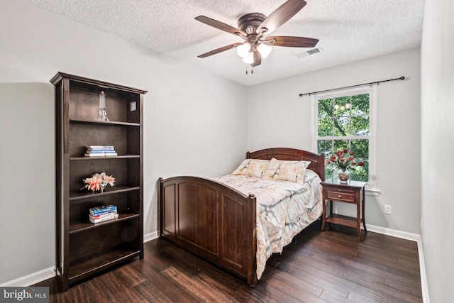 3901 Golf Tee Ct Unit 301, Fairfax, VA 22033 - bedroom with dark wood finished floors, a textured ceiling, baseboards, and ceiling fan