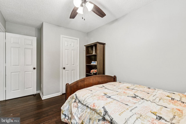 3901 Golf Tee Ct Unit 301, Fairfax, VA 22033 - bedroom featuring dark wood-type flooring, a textured ceiling, baseboards, and a ceiling fan
