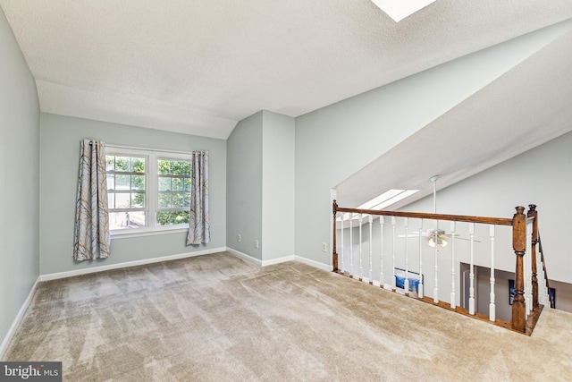 3901 Golf Tee Ct Unit 301, Fairfax, VA 22033 - carpeted spare room featuring baseboards, ceiling fan, lofted ceiling, and a textured ceiling