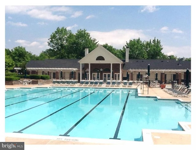 3901 Golf Tee Ct Unit 301, Fairfax, VA 22033 - community pool with a patio area