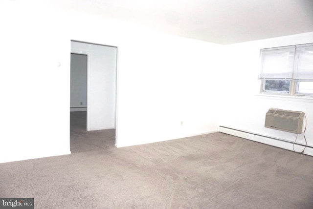 unfurnished room featuring carpet, a wall unit AC, and a baseboard heating unit