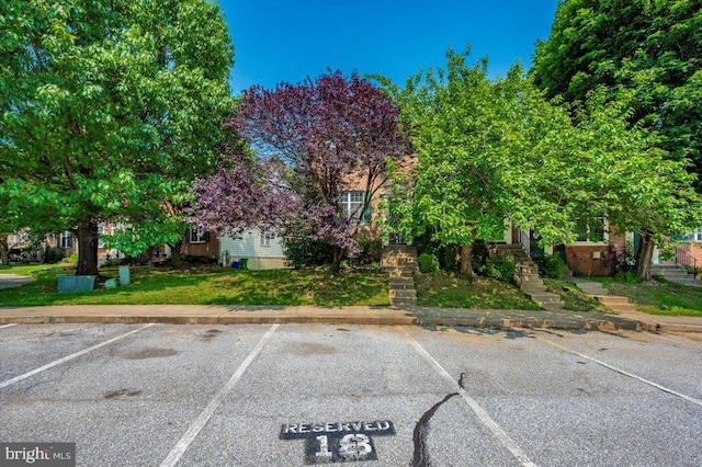 6343 Wind Rider Way, Columbia, MD 21045 - view of property hidden behind natural elements with uncovered parking and stairs