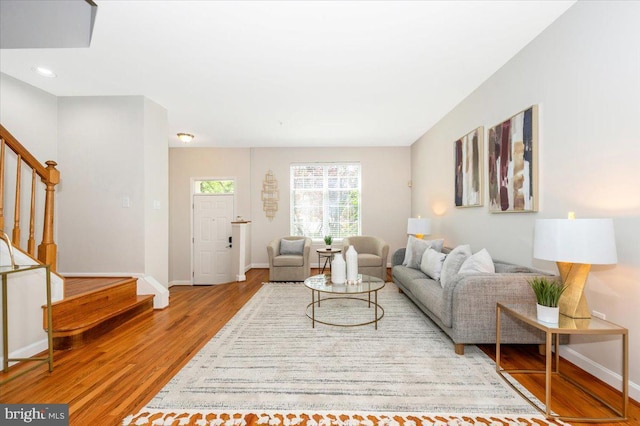 6343 Wind Rider Way, Columbia, MD 21045 - living room featuring stairs, wood finished floors, and recessed lighting