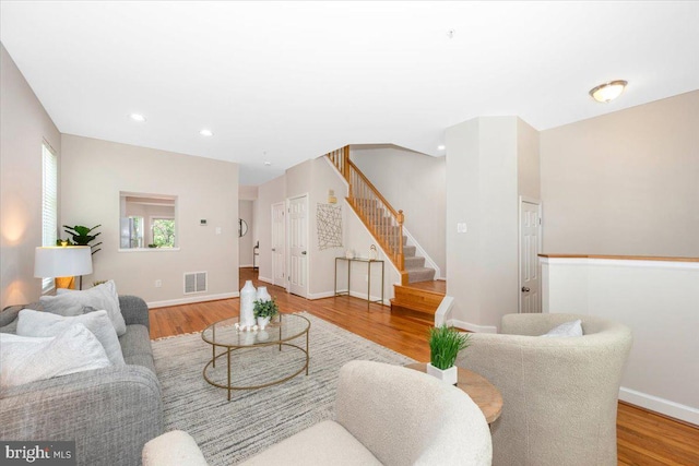 6343 Wind Rider Way, Columbia, MD 21045 - living area with stairway, wood finished floors, and recessed lighting