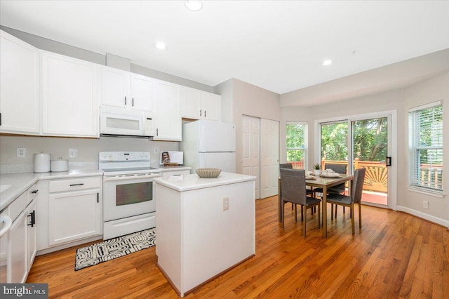 6343 Wind Rider Way, Columbia, MD 21045 - kitchen featuring white appliances, a kitchen island, light wood-style flooring, white cabinetry, and recessed lighting