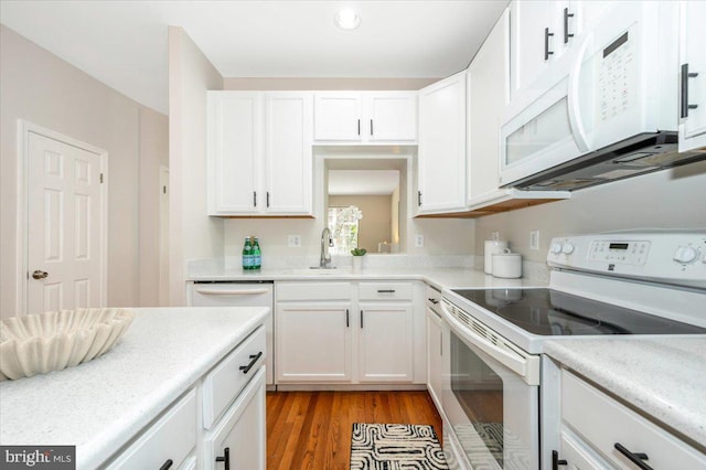 6343 Wind Rider Way, Columbia, MD 21045 - kitchen with white appliances, white cabinets, light wood-type flooring, and light countertops