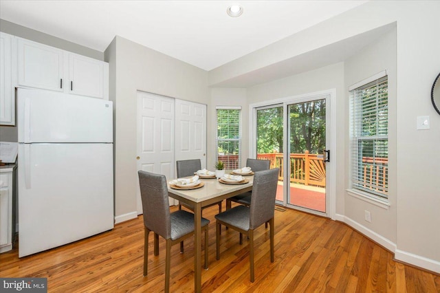 6343 Wind Rider Way, Columbia, MD 21045 - dining area with light wood-style floors and baseboards