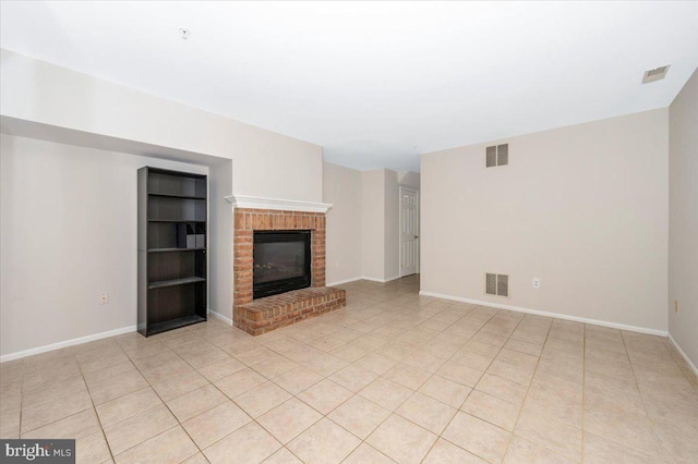 6343 Wind Rider Way, Columbia, MD 21045 - unfurnished living room with light tile patterned floors and a fireplace