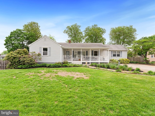 single story home with covered porch, fence, a front lawn, and a chimney