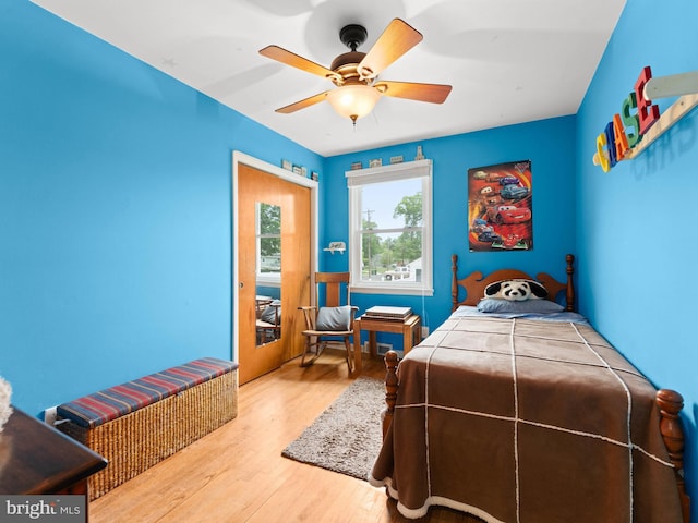bedroom featuring a ceiling fan and wood finished floors