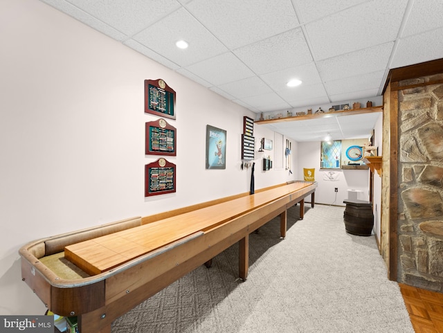 rec room featuring a drop ceiling and recessed lighting