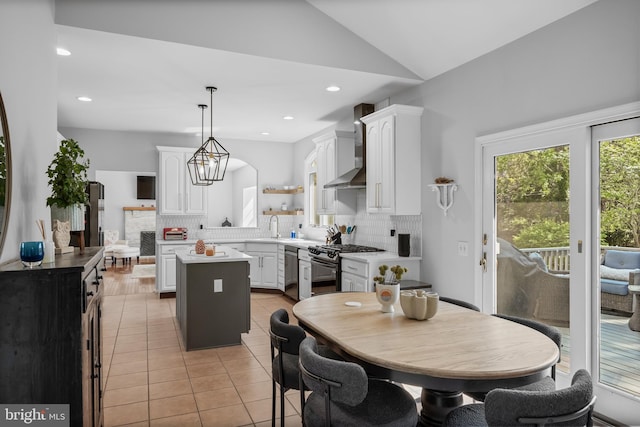 dining area with lofted ceiling, recessed lighting, and light tile patterned flooring