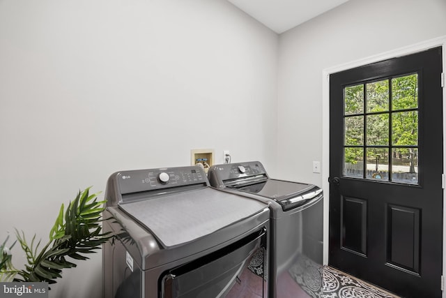 laundry room featuring washer and clothes dryer and laundry area