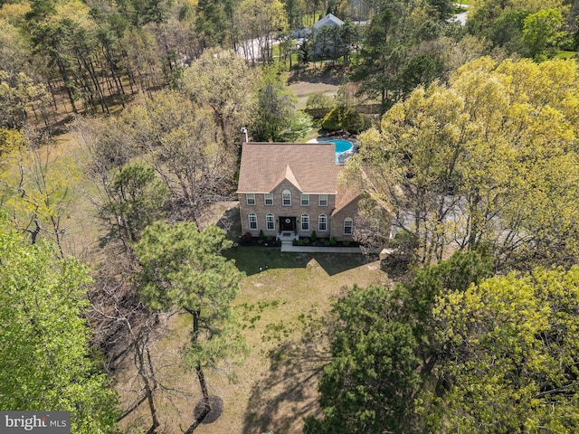 aerial view featuring a view of trees