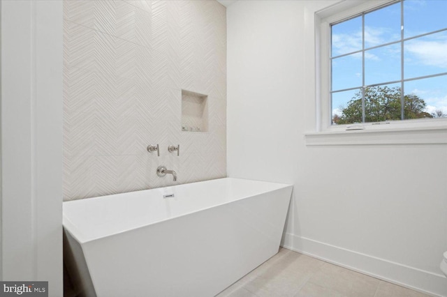 128 E Sharpnack St, Philadelphia, PA 19119 - bathroom featuring baseboards, tile patterned flooring, a freestanding tub, and wallpapered walls