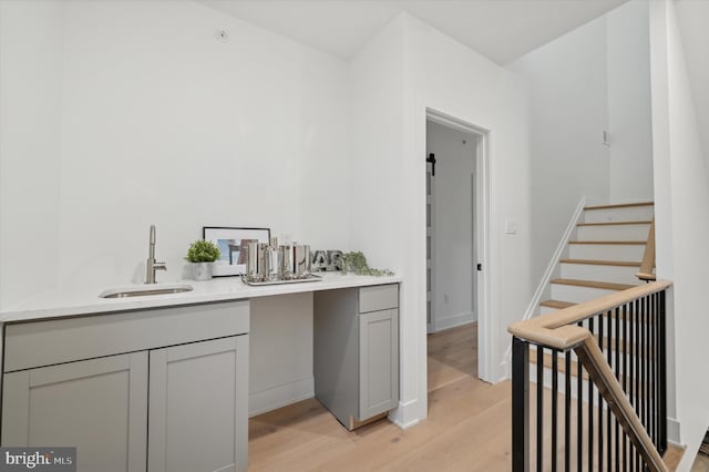 128 E Sharpnack St, Philadelphia, PA 19119 - indoor wet bar featuring light wood-style floors and stairway