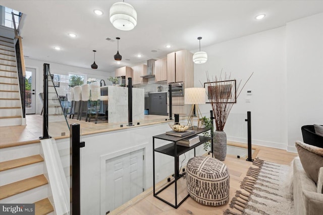 128 E Sharpnack St, Philadelphia, PA 19119 - living room with stairway, recessed lighting, light wood-style floors, and baseboards