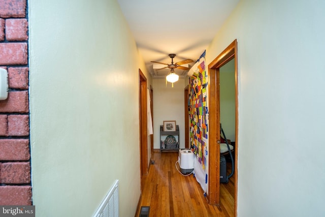 hall featuring wood finished floors