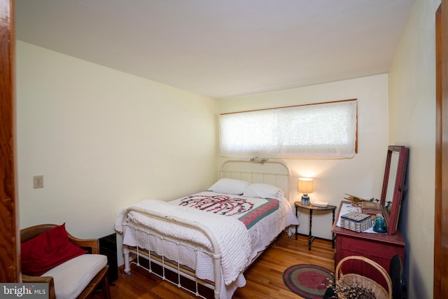 bedroom featuring wood finished floors