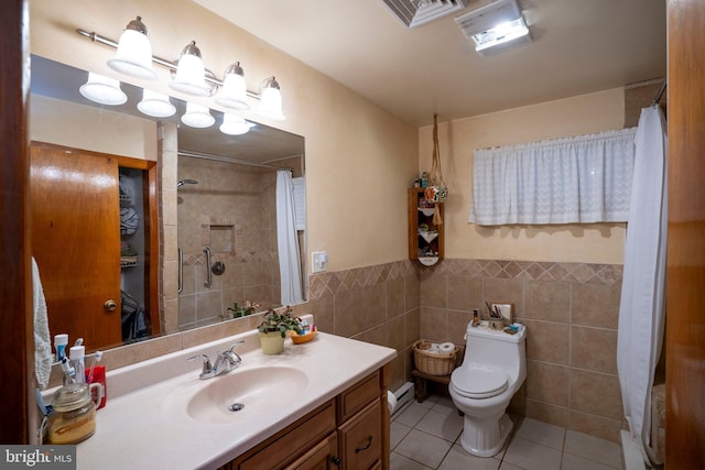bathroom featuring tile walls, tile patterned flooring, toilet, curtained shower, and a baseboard radiator