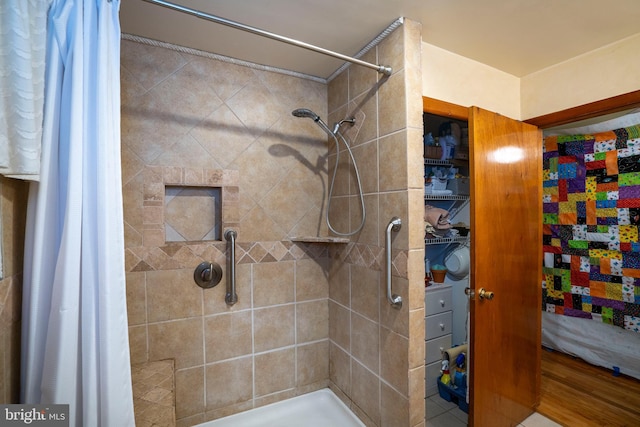 bathroom with a tile shower