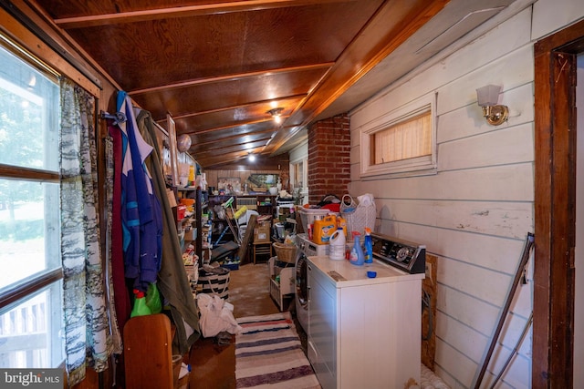 laundry area featuring wooden walls