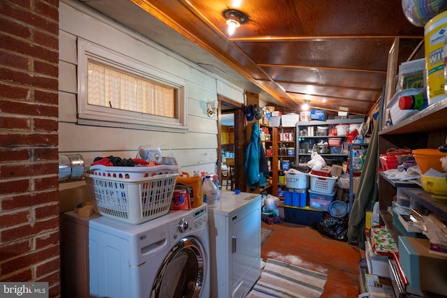 laundry room featuring independent washer and dryer and wood finished floors