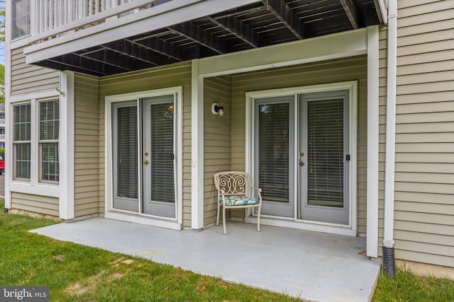 property entrance with french doors and a patio