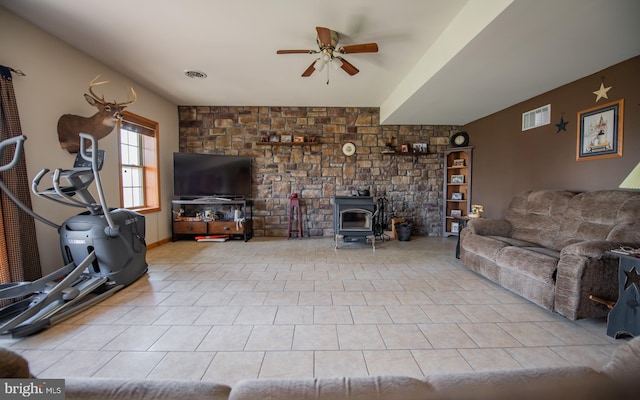 97 Heverly Ln, Beech Creek, PA 16822 - tiled living room with a wood stove, ceiling fan, and visible vents