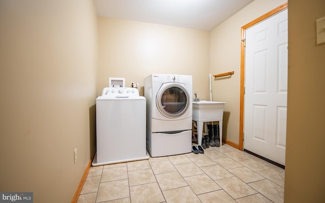 97 Heverly Ln, Beech Creek, PA 16822 - clothes washing area featuring baseboards, laundry area, light tile patterned flooring, and washer and dryer