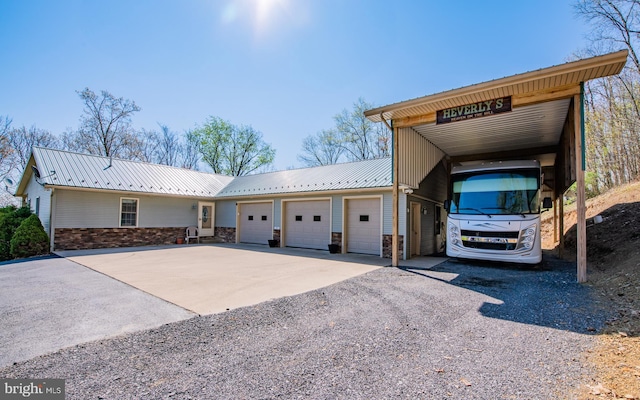 97 Heverly Ln, Beech Creek, PA 16822 - view of front of home featuring metal roof, stone siding, and driveway