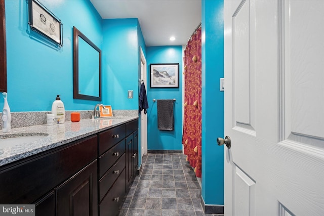 2935 S 13th St, Philadelphia, PA 19148 - full bathroom with baseboards, double vanity, recessed lighting, and stone finish floors