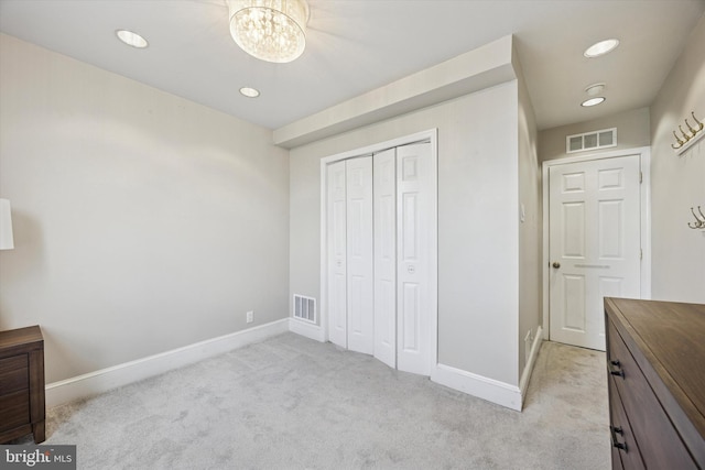 2935 S 13th St, Philadelphia, PA 19148 - unfurnished bedroom with light colored carpet, a chandelier, baseboards, recessed lighting, and a closet