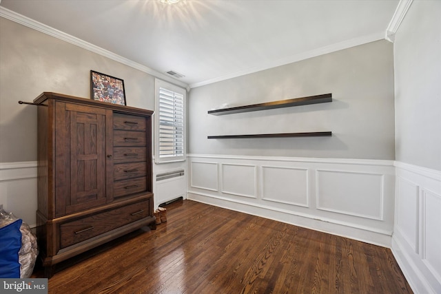 2935 S 13th St, Philadelphia, PA 19148 - unfurnished bedroom featuring ornamental molding, dark wood-style flooring, a wainscoted wall, radiator heating unit, and a decorative wall